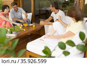 Couples having orange juice. Стоковое фото, фотограф Shannon Fagan / Ingram Publishing / Фотобанк Лори