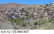 Picturesque Chokh town with old brick buildings on hill steep slope among fantastic mountains on sunny day in Dagestan, Russia (2021 год). Стоковое видео, видеограф Алексей Кузнецов / Фотобанк Лори