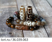 Tibetan Dzi natural beads - 9 eyes, Fortune, Big man, Money. Стоковое фото, фотограф ElenArt / Фотобанк Лори
