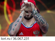 Российский рэп-исполнитель ST Александр Андреевич Степанов выступает на сцене гала-концерт, посвященного Дню России, 12 июня 2021. Редакционное фото, фотограф Николай Винокуров / Фотобанк Лори