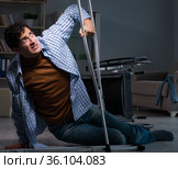 Man fell off wheelchair sitting on the floor. Стоковое фото, фотограф Elnur / Фотобанк Лори