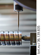 quality measuring in metal cutting industry. probe measure ball screw threaded shaft. Стоковое фото, фотограф Дмитрий Калиновский / Фотобанк Лори
