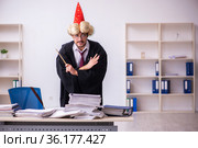 Funny young male employee magician and too much work in the office. Стоковое фото, фотограф Elnur / Фотобанк Лори