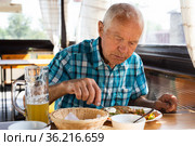 señor dines on the terrace restaurant in the afternoon. Стоковое фото, фотограф Татьяна Яцевич / Фотобанк Лори