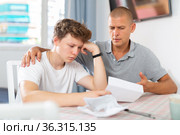 Son and his father reading letter. Стоковое фото, фотограф Яков Филимонов / Фотобанк Лори
