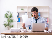 Young male employee rejecting new ideas in the office. Стоковое фото, фотограф Elnur / Фотобанк Лори