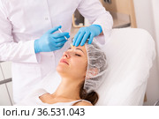 Woman getting facial contouring injections. Стоковое фото, фотограф Яков Филимонов / Фотобанк Лори