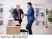 Two male employees working in the office. Стоковое фото, фотограф Elnur / Фотобанк Лори