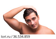 Man doing his hair isolated on white. Стоковое фото, фотограф Elnur / Фотобанк Лори