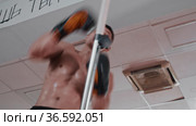 Shirtless sweaty young man training boxing in the gym. Стоковое видео, видеограф Константин Шишкин / Фотобанк Лори