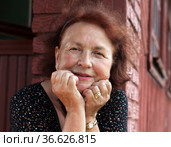 Senior woman on porch of country house. Стоковое фото, фотограф Дарья Трофимова / Фотобанк Лори