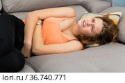 female holding hands on the illness stomache. Стоковое фото, фотограф Яков Филимонов / Фотобанк Лори