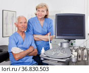 Qualified doctors near modern ultrasound machine. Стоковое фото, фотограф Яков Филимонов / Фотобанк Лори