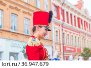 Russia, Samara, July 2019: a beautiful girl in a hussar costume on Kuibyshev street at the carnival dedicated to the World Cup. Редакционное фото, фотограф Акиньшин Владимир / Фотобанк Лори