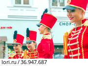 Russia, Samara, July 2019: a beautiful girl in a hussar costume on Kuibyshev street at the carnival dedicated to the World Cup. Редакционное фото, фотограф Акиньшин Владимир / Фотобанк Лори