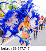Russia, Samara, July 2019: processions of beautiful dressed up girls on Kuibyshev street at the carnival dedicated to the World Cup. Редакционное фото, фотограф Акиньшин Владимир / Фотобанк Лори