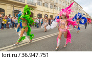 Russia, Samara, July 2019: processions of beautiful dressed up girls on Kuibyshev street at the carnival dedicated to the World Cup. Редакционное фото, фотограф Акиньшин Владимир / Фотобанк Лори