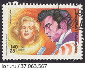 Портреты Мэрилин Монро и Элвиса Пресли. Почтовая марка Мадагаскара 1994 года. Редакционная иллюстрация, иллюстратор александр афанасьев / Фотобанк Лори