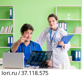 Woman and man doctors radiologists working at the clinic. Стоковое фото, фотограф Elnur / Фотобанк Лори