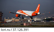 Airplane EasyJet airline lands on the runway in an aeroport El Prat city of Barcelona. Board number G-EZFZ (2020 год). Редакционное фото, фотограф Яков Филимонов / Фотобанк Лори