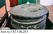 Process of forming stack of fiber mats with milled olive paste, preparing to press on artisanal olive oil factory. Стоковое видео, видеограф Яков Филимонов / Фотобанк Лори