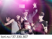Family with children playfully poses in virtual reality glasses. Стоковое фото, фотограф Яков Филимонов / Фотобанк Лори
