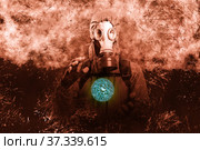 A shot of a man dressed in a gas mask, a jacket with a hood, a backpack, holding his hands in front of him as if there was something in them, looking into the camera. poster on the background of grunge. Стоковое фото, фотограф Владимир Арсентьев / Фотобанк Лори