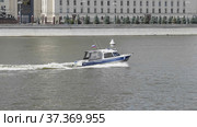 MOSCOW - MAY 7: Boat police of Russia floating on the Moscow river on May 7, 2017 in Moscow, Russia. Стоковое фото, фотограф Фотограф / Фотобанк Лори