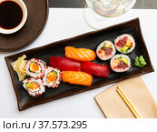 Popular Japanese dish sushi combo, which includes of Uramakis, Makis and Nigiris. Стоковое фото, фотограф Яков Филимонов / Фотобанк Лори