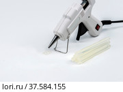 Hot melt glue gun on white background. Стоковое фото, фотограф Андрей Никитин / Фотобанк Лори