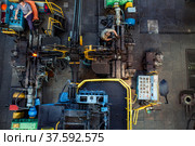 Stepnogorsk, Kazakhstan April 04, 2012: Bearing production plant workshop panorama. Production red hot outer-race ring parts on conveyor. Редакционное фото, фотограф Alexey Rezvykh / Фотобанк Лори