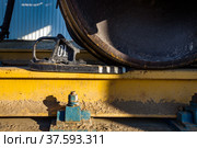 Hopper car railroad terminal. Phosphate fertilizers plant. Close-up part of Wagon wheel with brake shoe. Yellow clay dirt on rail. Стоковое фото, фотограф Alexey Rezvykh / Фотобанк Лори