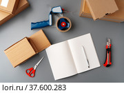 Above table top view of warehouse preparing post courier delivery package. Стоковое фото, фотограф Сергей Толмачёв / Фотобанк Лори