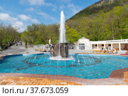 Fountain in the form of mugs in the resort park in Zheleznovodsk, Stavropol Territory, Russia - May 1, 2021. Редакционное фото, фотограф Наталия Попова / Фотобанк Лори