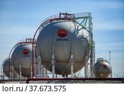 Zhanazhol, Aktobe region, Kazakhstan - May 04, 2012: Sphere gas storage tanks for liquefied petroleum (natural) gas (LPG, LNG). Oil refinery plant, CNPC company. Редакционное фото, фотограф Alexey Rezvykh / Фотобанк Лори
