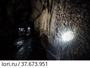 Khromtau, Aktobe region, Kazakhstan - May 06 2012: Gold mine. Miners in underground gallery. Редакционное фото, фотограф Alexey Rezvykh / Фотобанк Лори