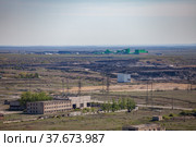 Aerial view on Mechel company mining and processing plant. Quarry and abandoned industrial building on foreground. Стоковое фото, фотограф Alexey Rezvykh / Фотобанк Лори
