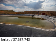 Almaty region, Kazakhstan: Extraction of gold ore. Mining and processing plant. Pond for chemical refining by sodium cyanide. Стоковое фото, фотограф Alexey Rezvykh / Фотобанк Лори