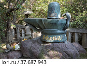 The methal Shiva Linga in Toganji temple. Nagoya. Japan (2007 год). Редакционное фото, фотограф Сергей Пристяжнюк (Serg Zastavkin) / Фотобанк Лори