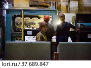Temirtau, Kazakhstan - June 09, 2012: Concrete sleepers manufacturing plant NORD Prom NS. Workers and vibration line equipment. Редакционное фото, фотограф Alexey Rezvykh / Фотобанк Лори