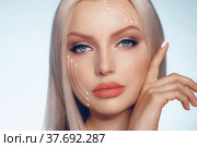 Caucasian beautiful female face marked with arrows on the main facial lifting lines. Стоковое фото, фотограф Сергей Толмачёв / Фотобанк Лори