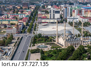 Russia. The Chechen Republic. Panoramic view of the city of Grozny and the heart of Chechnya mosque from the roof of the Grozny City skyscraper. Summer, a sunny day. S (2020 год). Редакционное фото, фотограф Yuriy Savin / Фотобанк Лори