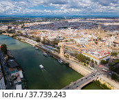 Aerial view Sevilla of city center with embankment of Guadalquivir. Стоковое фото, фотограф Яков Филимонов / Фотобанк Лори