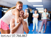 Young woman performing chokehold. Стоковое фото, фотограф Яков Филимонов / Фотобанк Лори