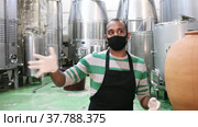 Winery worker checks the pressure in a steel barrel. Стоковое видео, видеограф Яков Филимонов / Фотобанк Лори