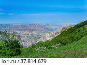 Mountain landscape in the Caucasus with a view of the valley of the Sulak River and the towns of New Zubutli and Kizilyurt in the distance. Стоковое фото, фотограф Евгений Харитонов / Фотобанк Лори