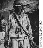 Наёмник в зоне боевых действий. Солдат после боя. Специальное, военное снаряжение. Стоковое фото, фотограф Виталий Михайлюк / Фотобанк Лори