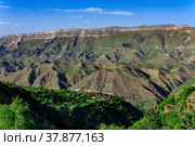 Mountain landscape, a huge canyon with an abandoned farm on one of the ledges. Стоковое фото, фотограф Евгений Харитонов / Фотобанк Лори