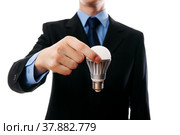 Business man with LED light bulb. Стоковое фото, фотограф Станислав Тарко / Фотобанк Лори