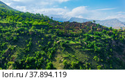 Ruins of houses on a mountainside in Kurib, a depopulated village with the only remaining household with an apiary, Dagestan. Стоковое фото, фотограф Евгений Харитонов / Фотобанк Лори